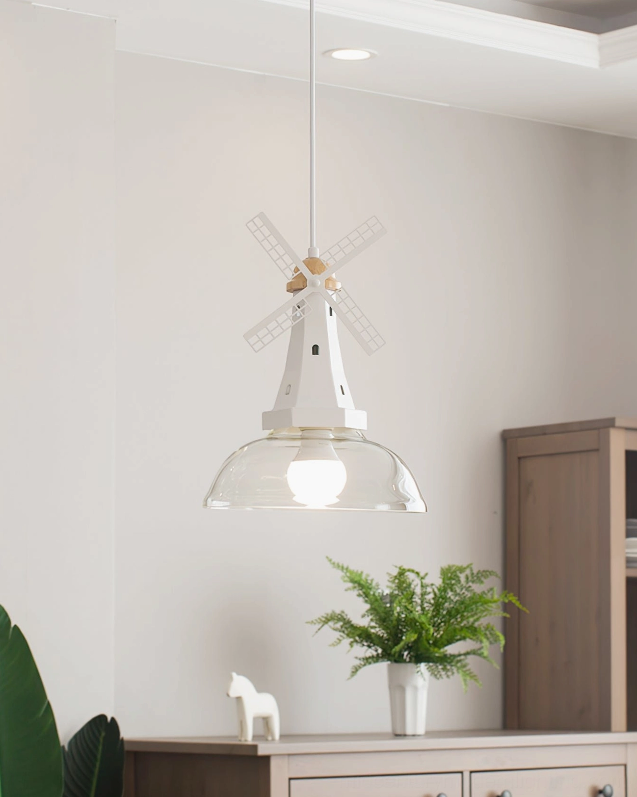 Windmill pendant light installation showing wire adjustment and ceiling mount compatibility