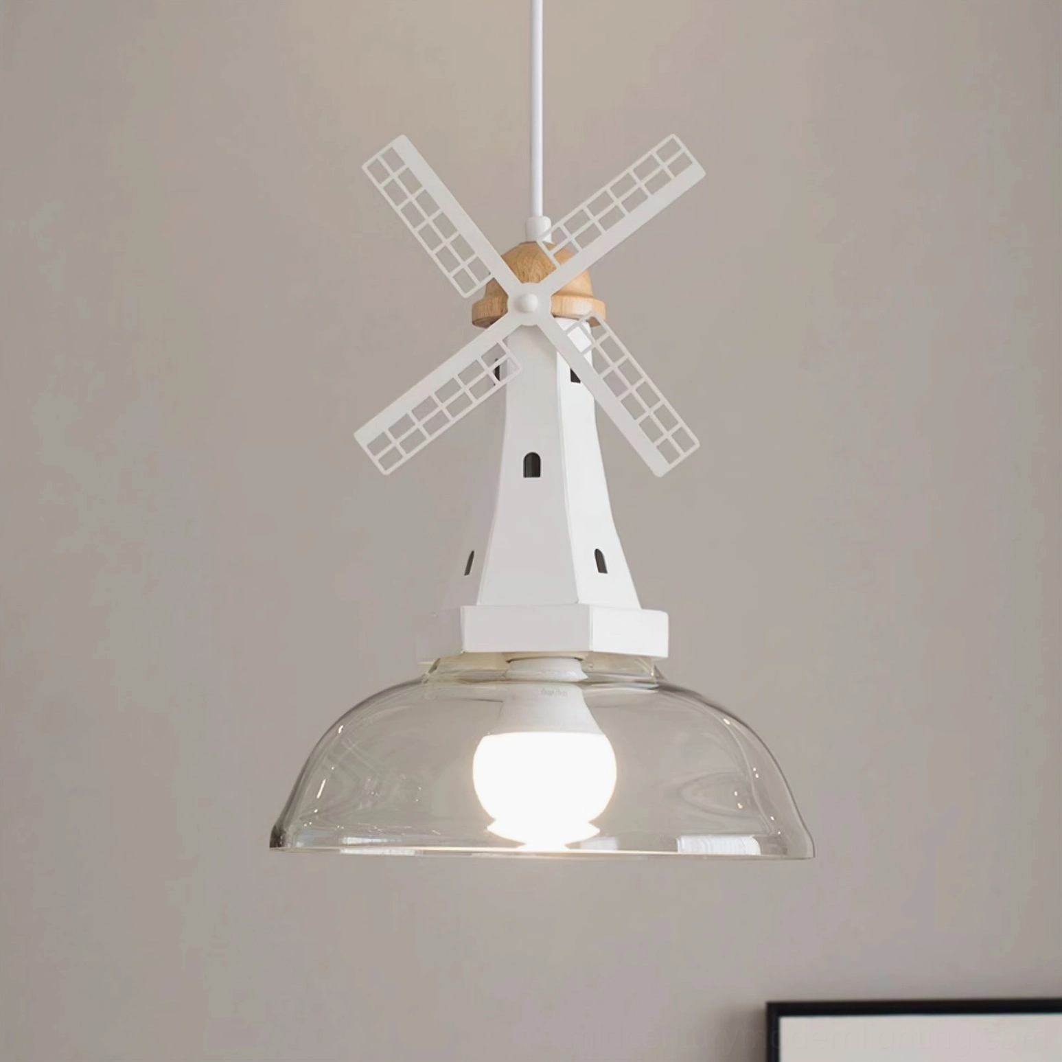 Windmill pendant light multiple angle view showing sculptural design and lighting effect