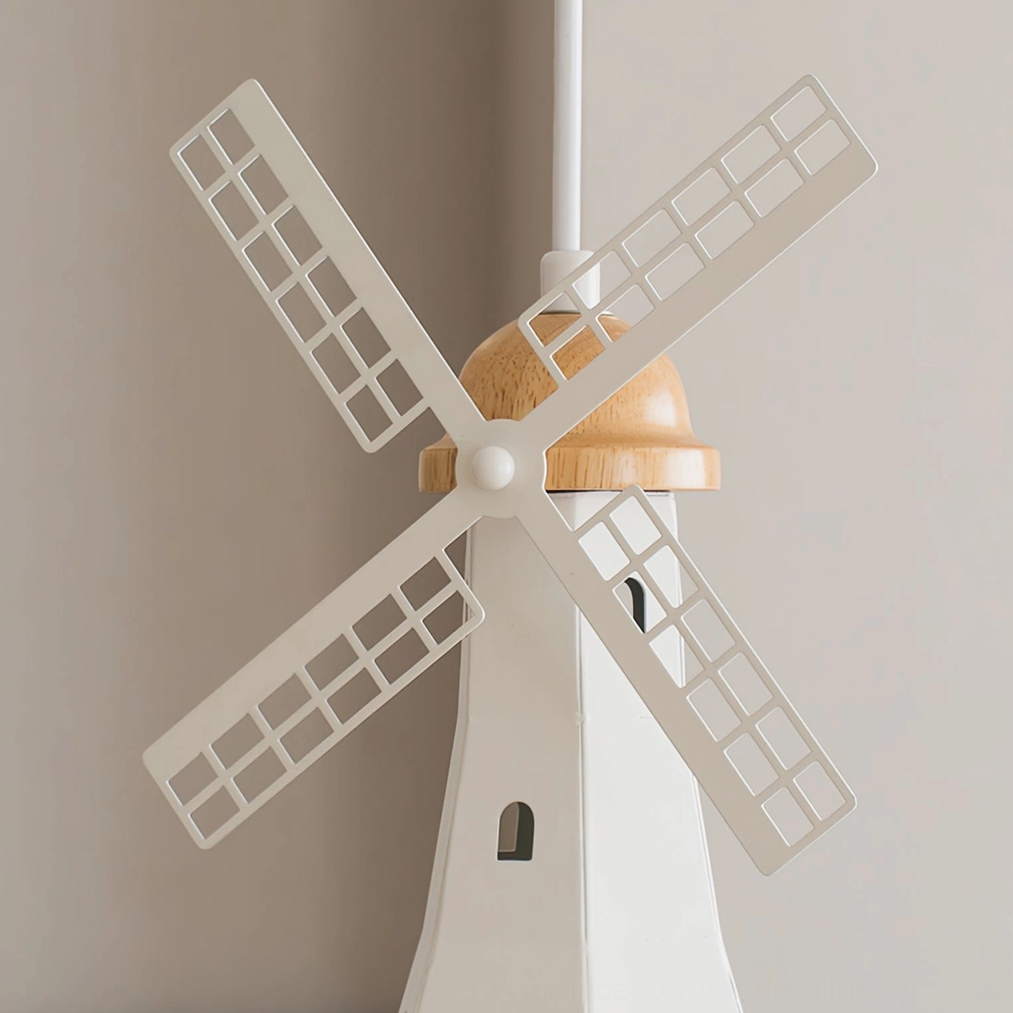 Mid-century modern windmill pendant side profile showing clean frame and wood accent cap