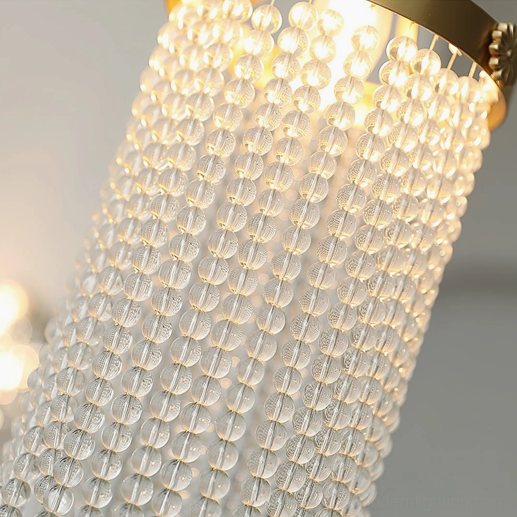 Detailed view of Winham crystal bead curtain with dense clear glass beads creating warm ambient glow in indoor setting