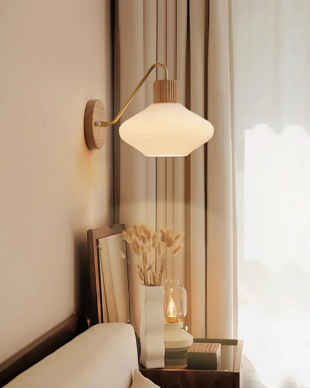 Wohlert wall sconce with brass and wood materials showing craftsmanship