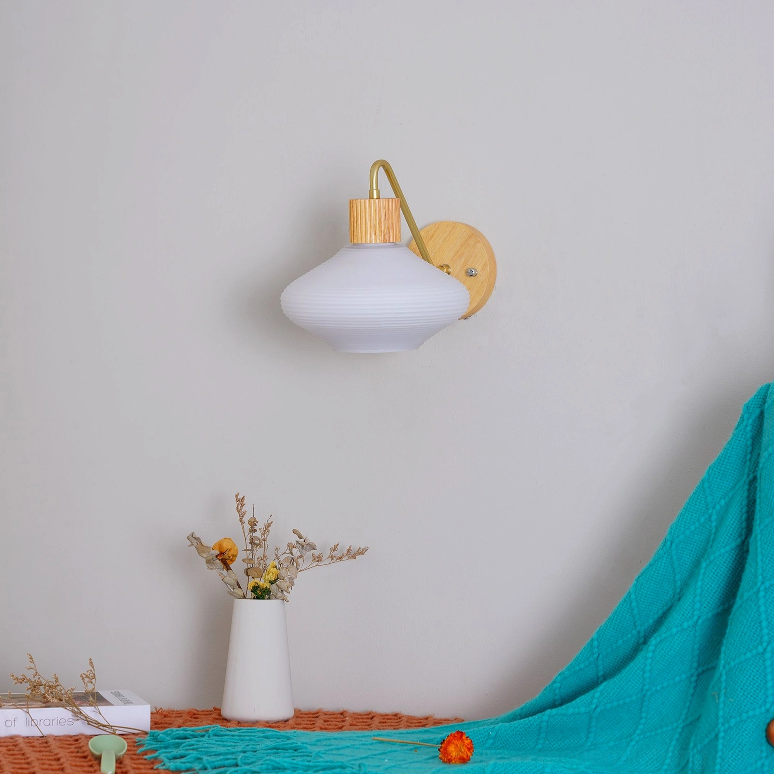Wohlert mid-century modern sconce with curved brass mounting arm