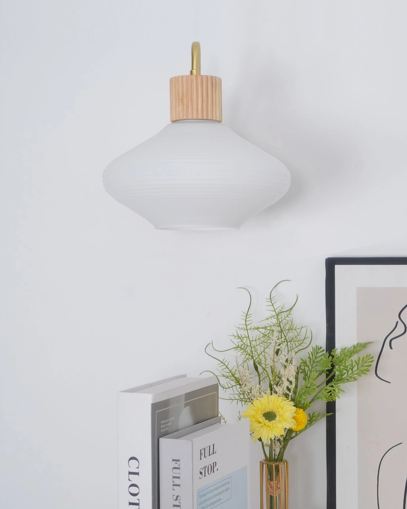 Wohlert Nordic glass sconce with wood base and warm lighting effect
