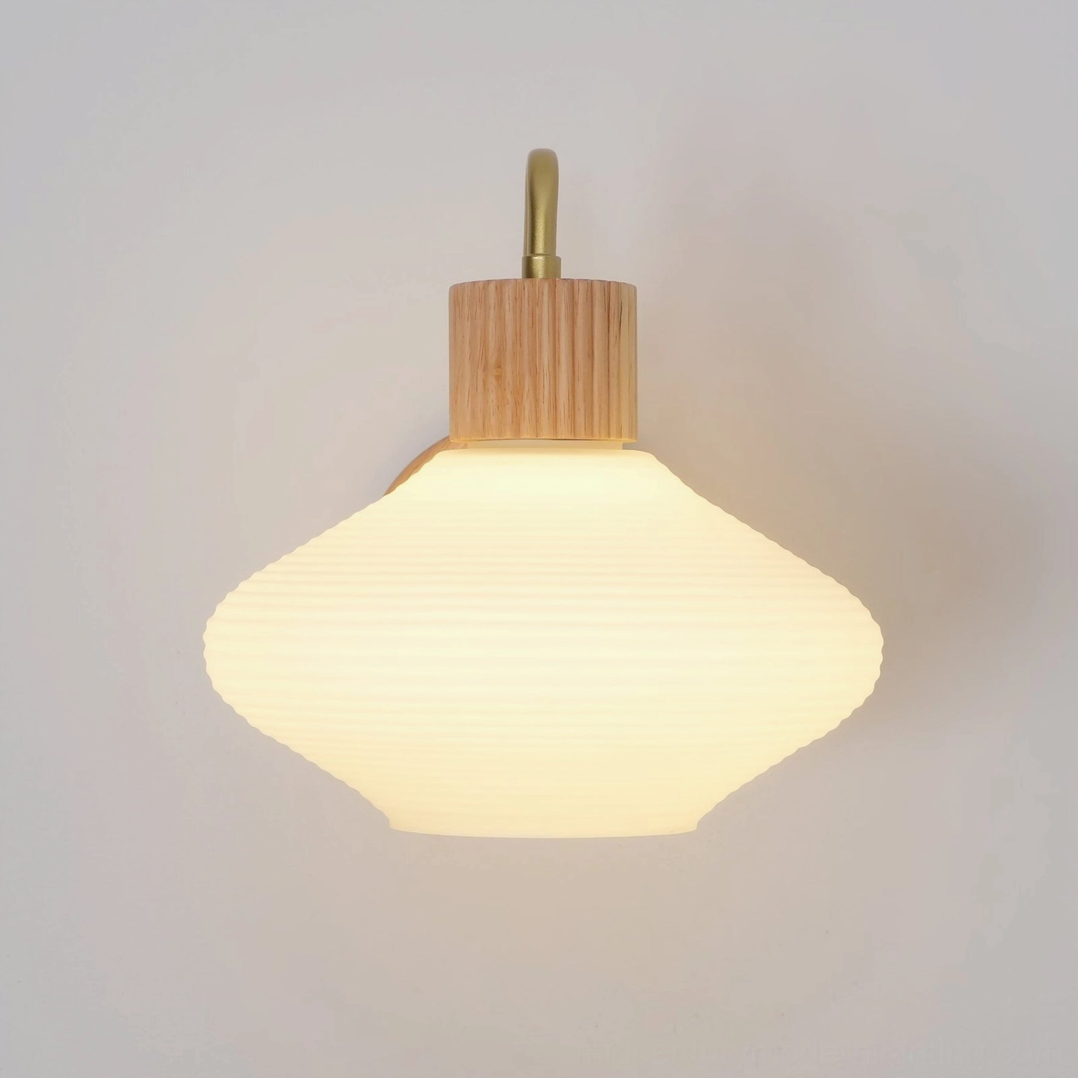 Wohlert wall-mounted Nordic sconce with warm ambient lighting effect