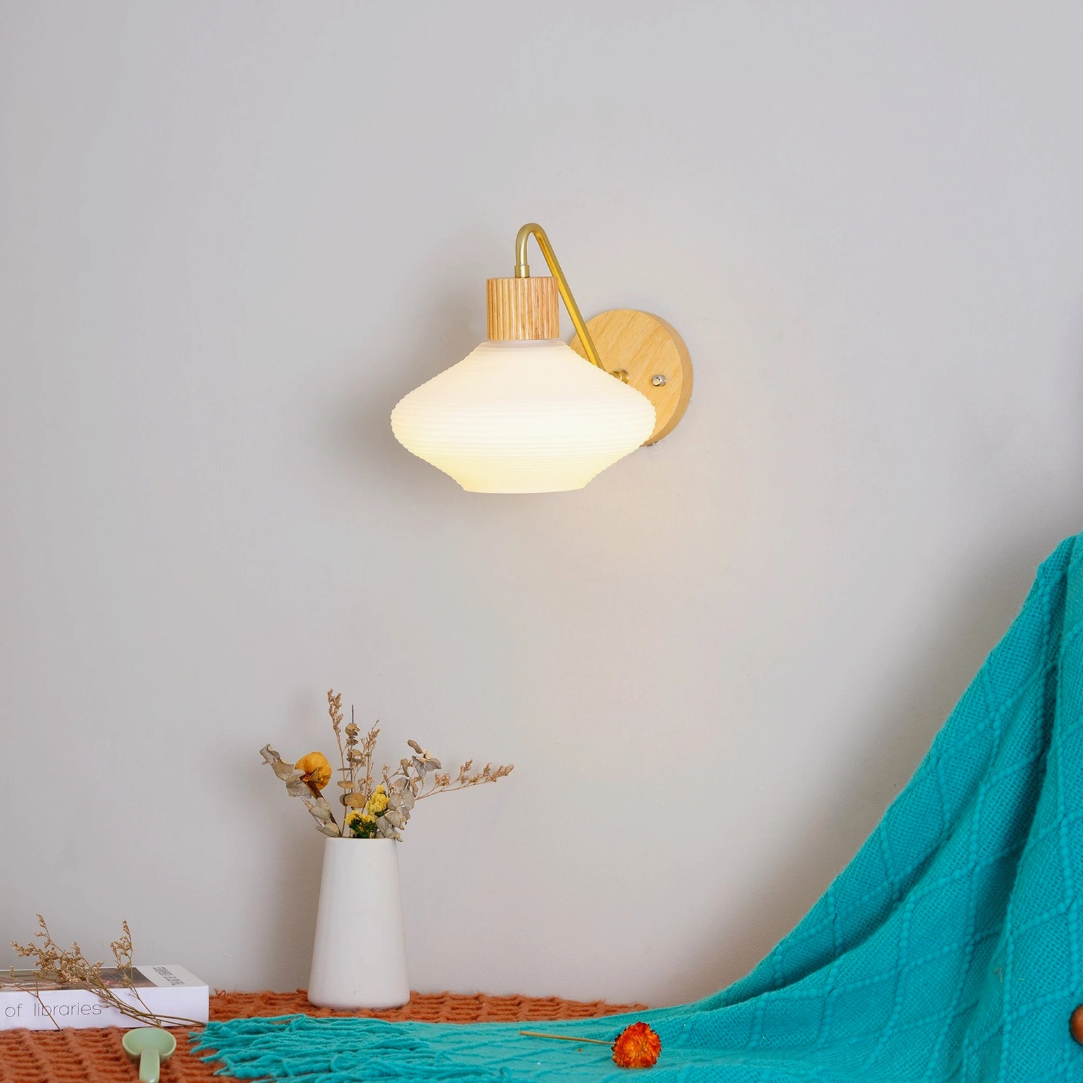 Wohlert wall-mounted sconce with ribbed frosted shade texture detail