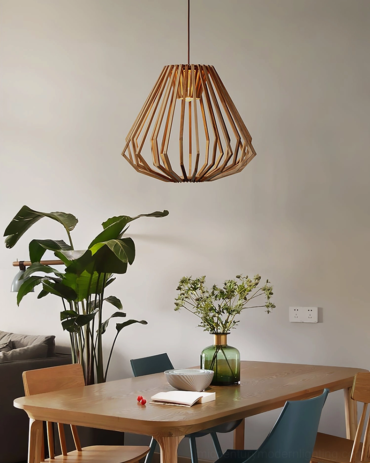 Wood cage pendant light with geometric lattice pattern and warm natural wood finish in interior setting