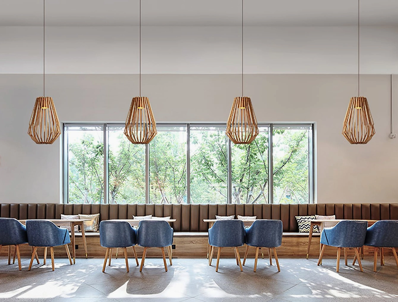 Four wood cage pendant lights in modern cafe with floor-to-ceiling windows showing minimalist warm wood decor