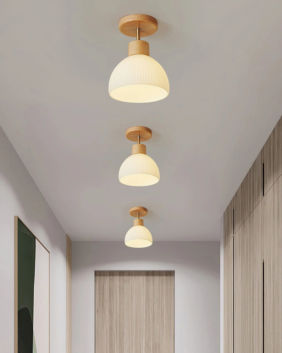 Natural wood base and ceramic shade junction of modern ceiling lamp, craftsmanship detail