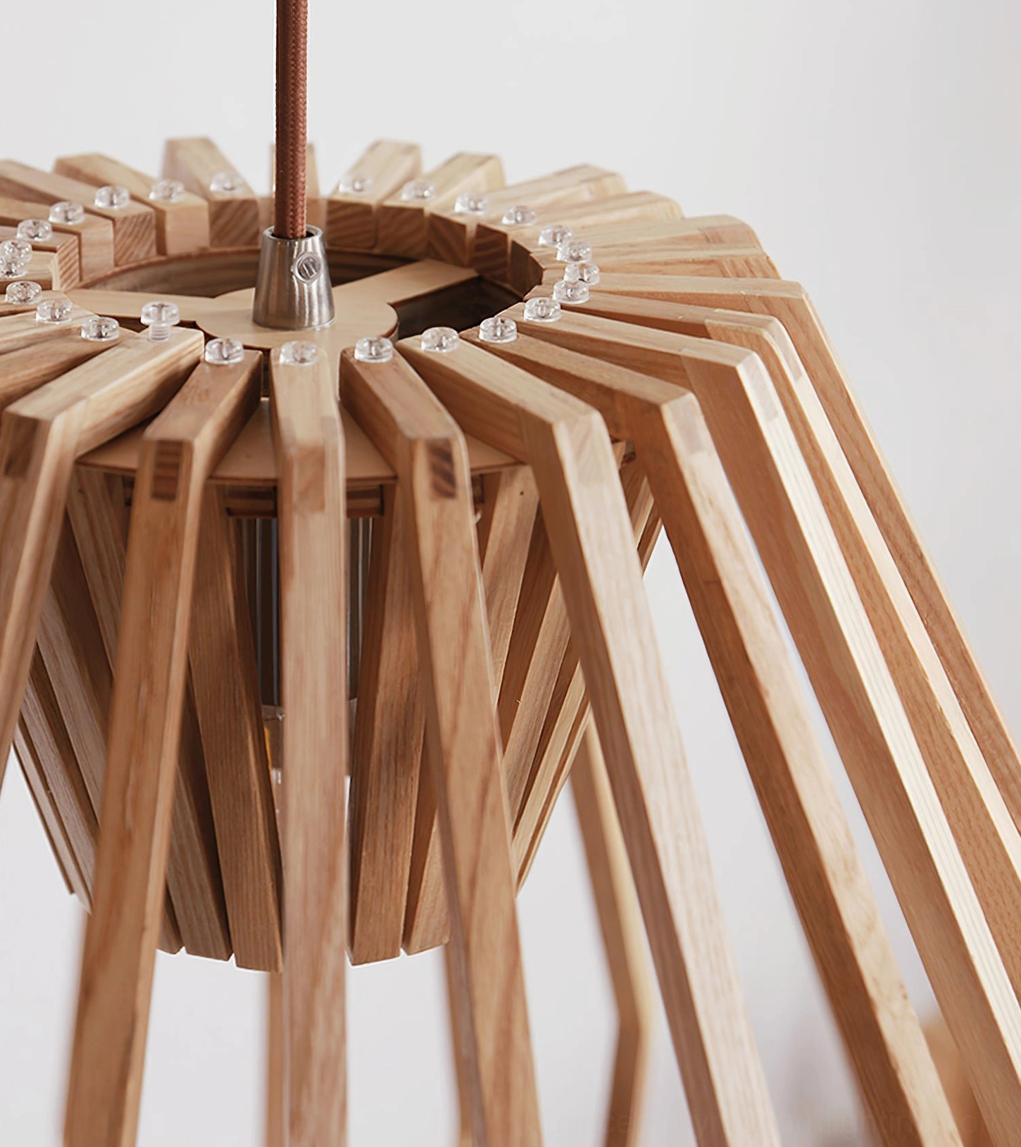 Wooden slat cage pendant fixture in modern residential setting showing contemporary minimalist application