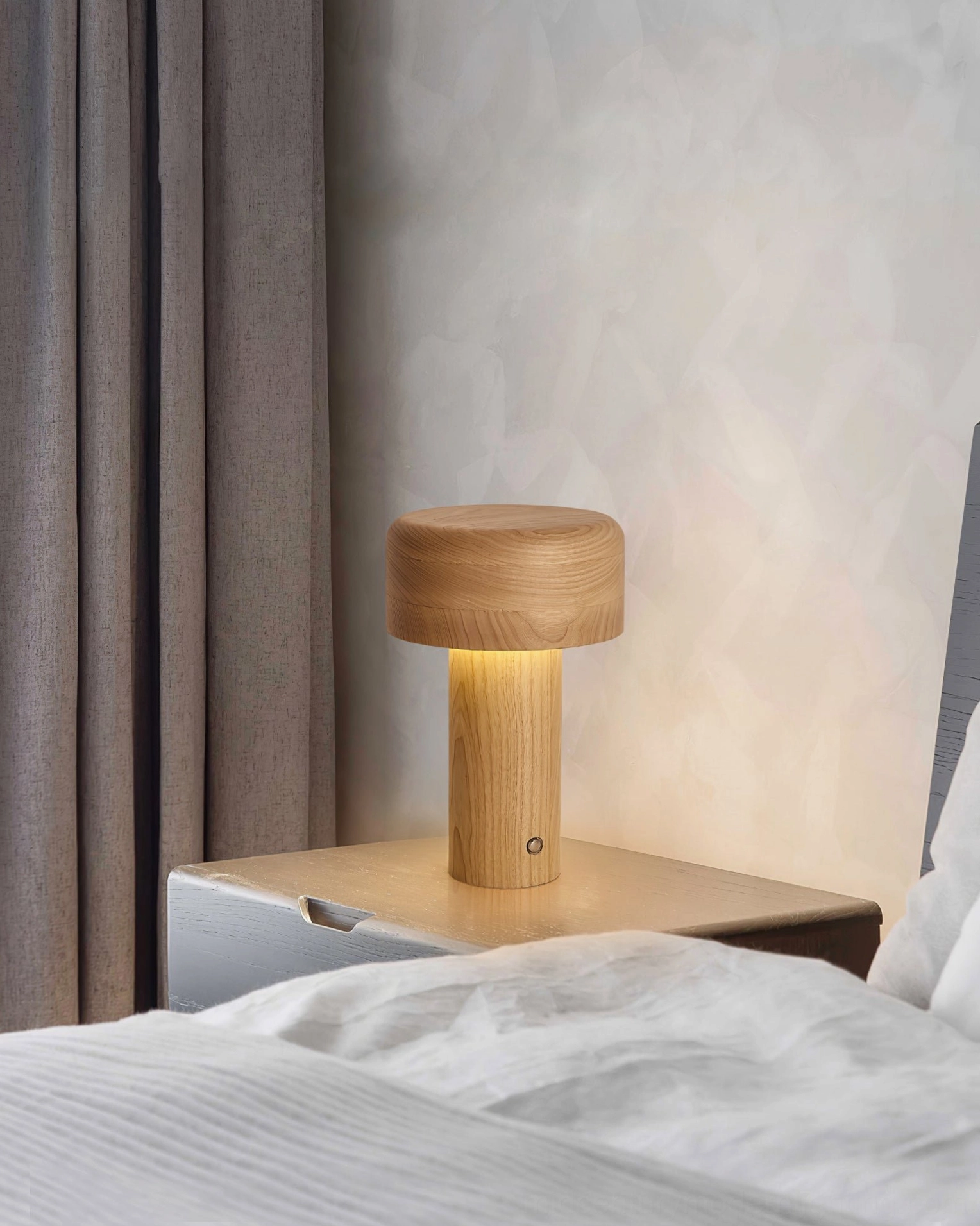 Natural wood table lamp providing ambient lighting for meditation and relaxation space