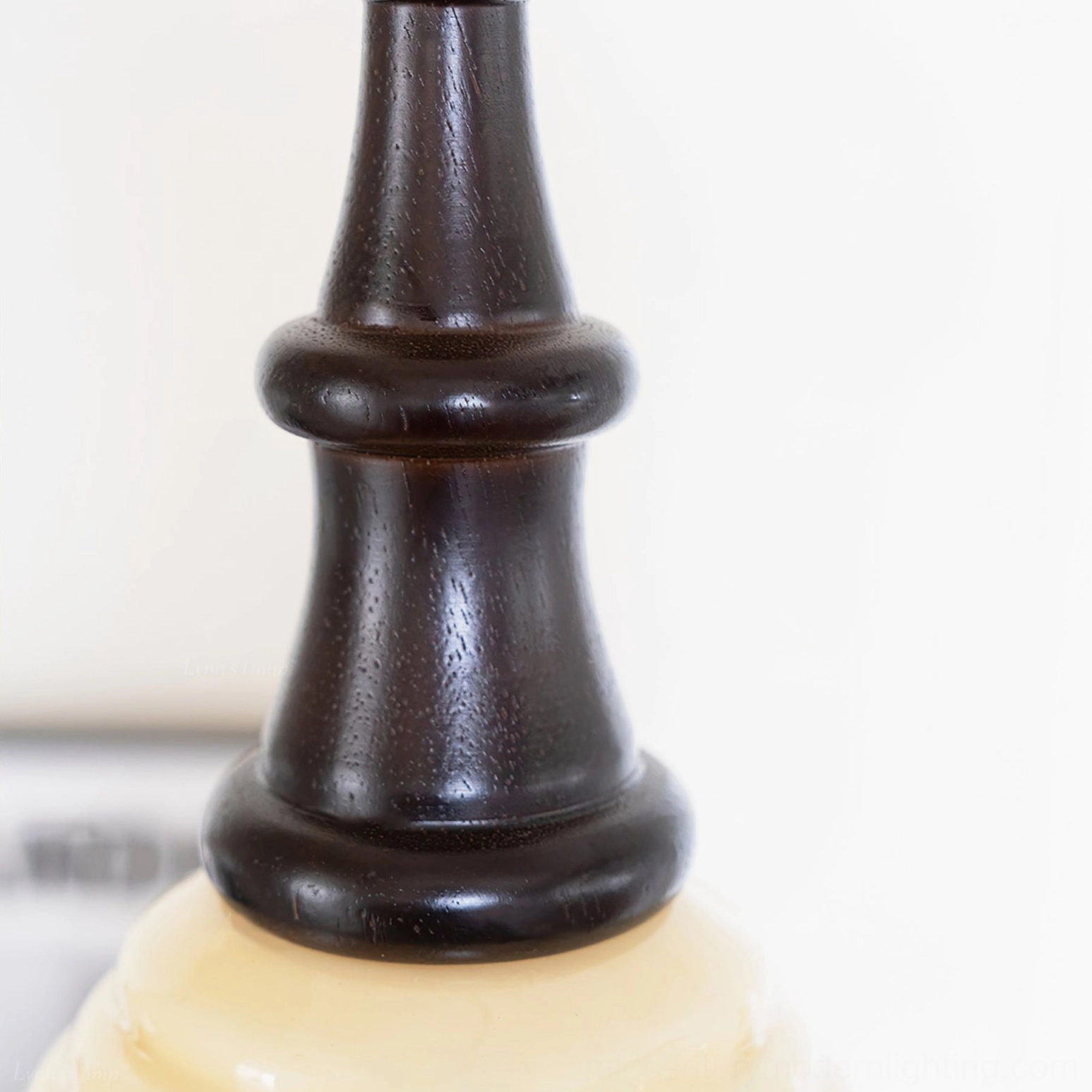 Close-up detail of mid-century wooden pendant light upper fixture showing polished dark wood tiered design and hardware craftsmanship