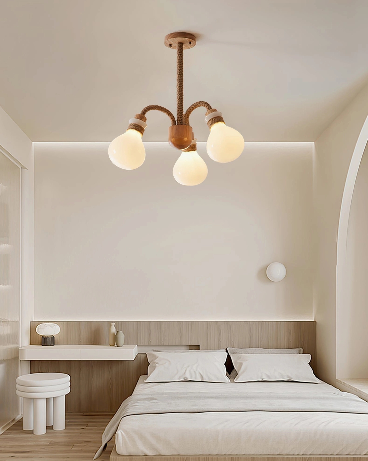 4-light compact wooden chandelier in minimalist bedroom creating wabi-sabi aesthetic with soft natural tones