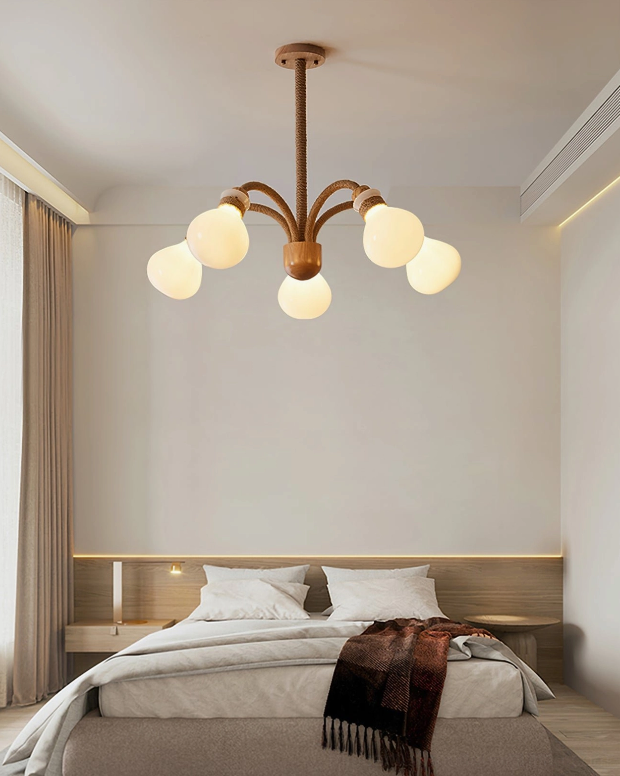 Angled view of multi-head wooden rope chandelier highlighting sculptural hemp rope design and wooden construction