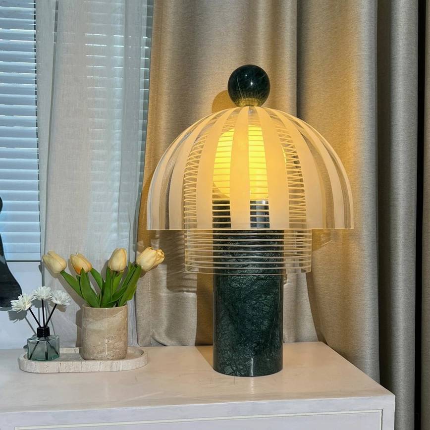 Yasuke table lamp on console table beside window with tulips and beige curtains, three-quarter view