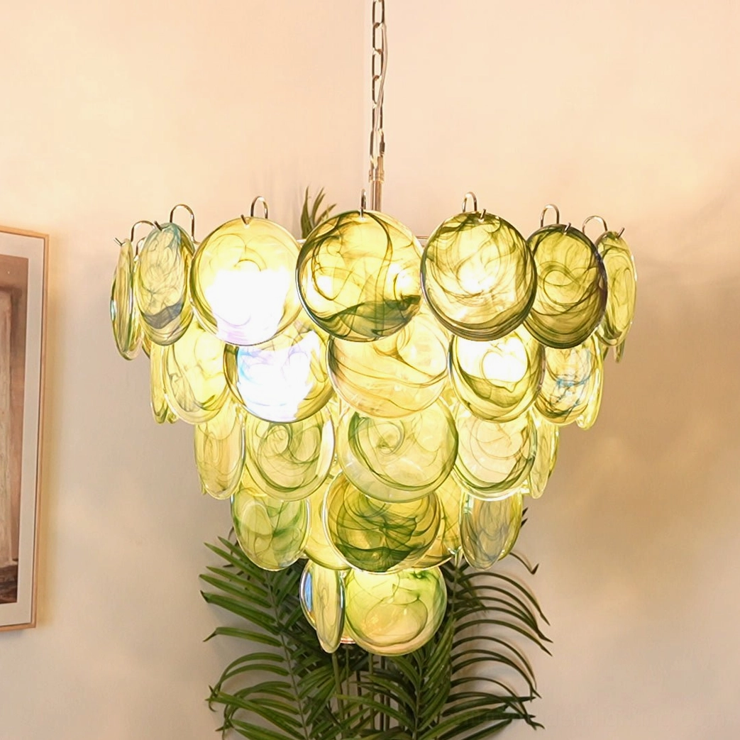 Warm yellow-toned disc chandelier with creamy glass discs creating glowing ambient light effect in contemporary home corner
