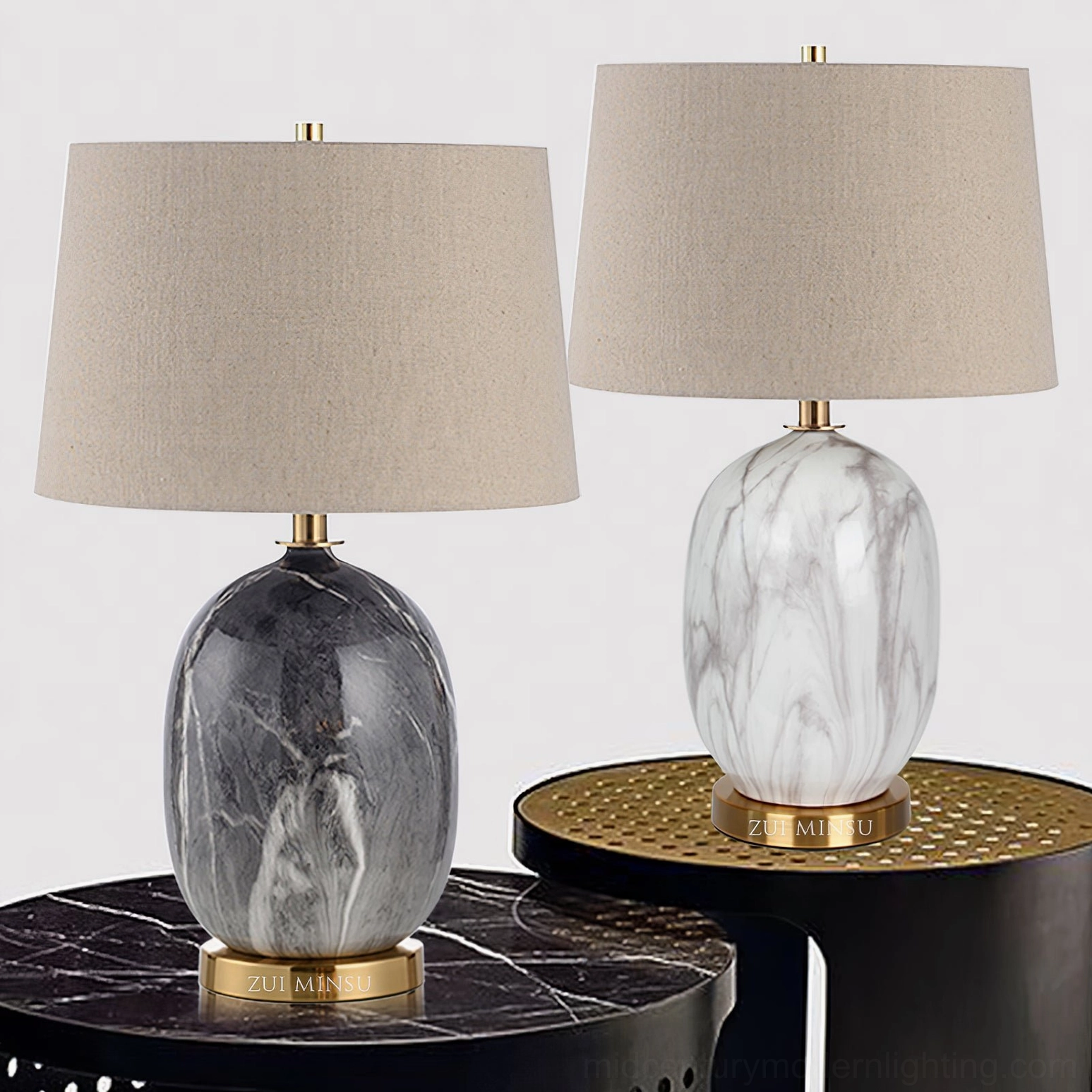Two Yopal table lamps in white and black marble finishes displayed side by side