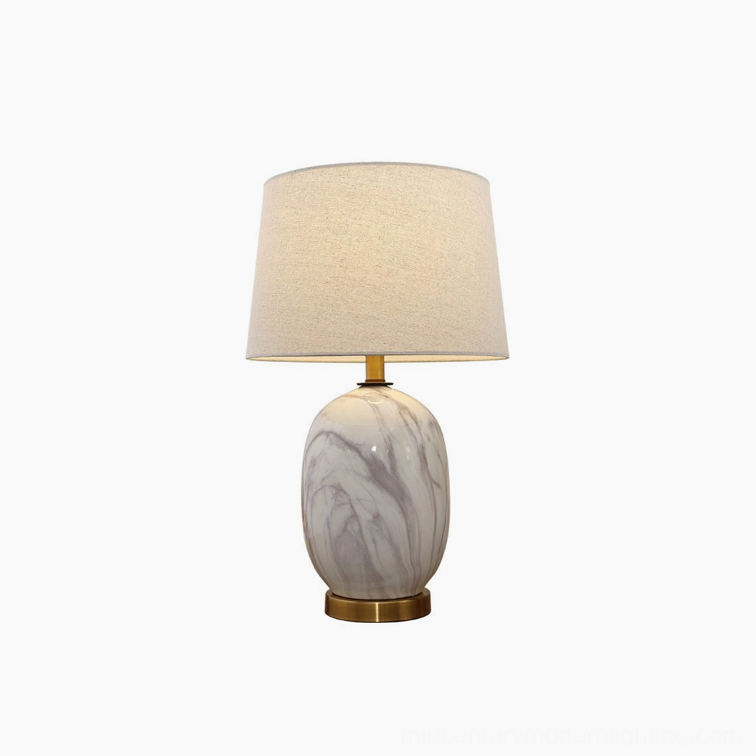 White Yopal table lamp with linen shade on nightstand, creating soft inviting bedroom lighting