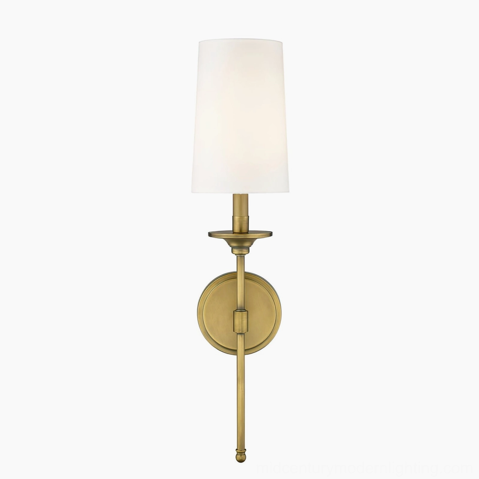 Slim stem minimalist brass wall sconce with round mounting plate studio view