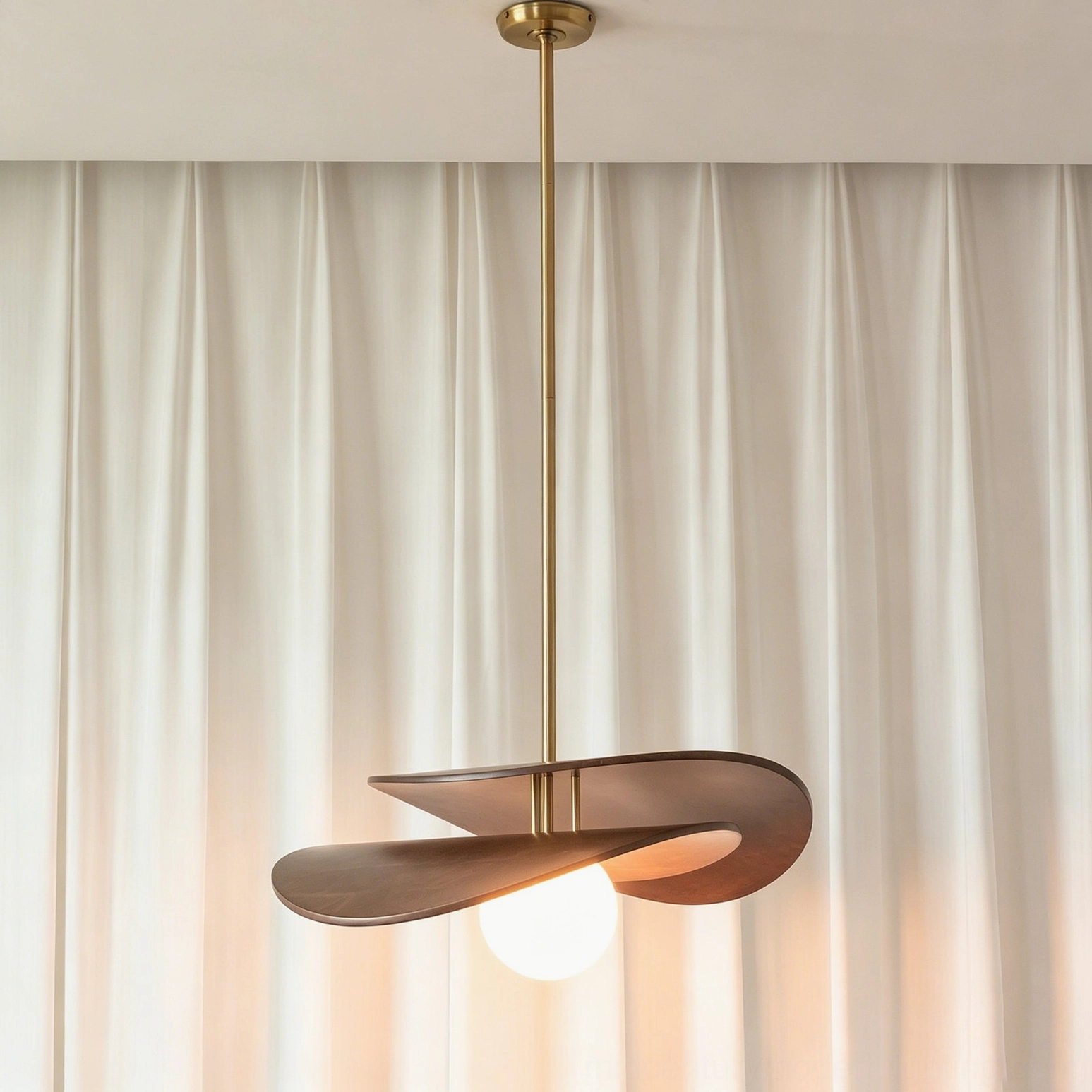 Unlit Zane mid-century modern pendant light showing minimalist design with brass suspension rod and opal glass globe