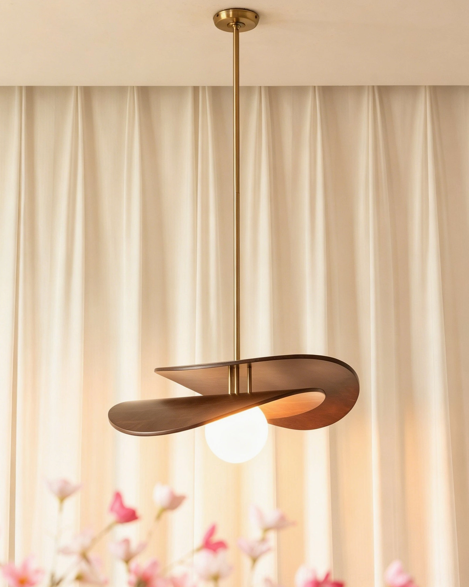 Lit Zane pendant light with warm glow from Edison bulb, side three-quarter view showing twisted wood sculptural form