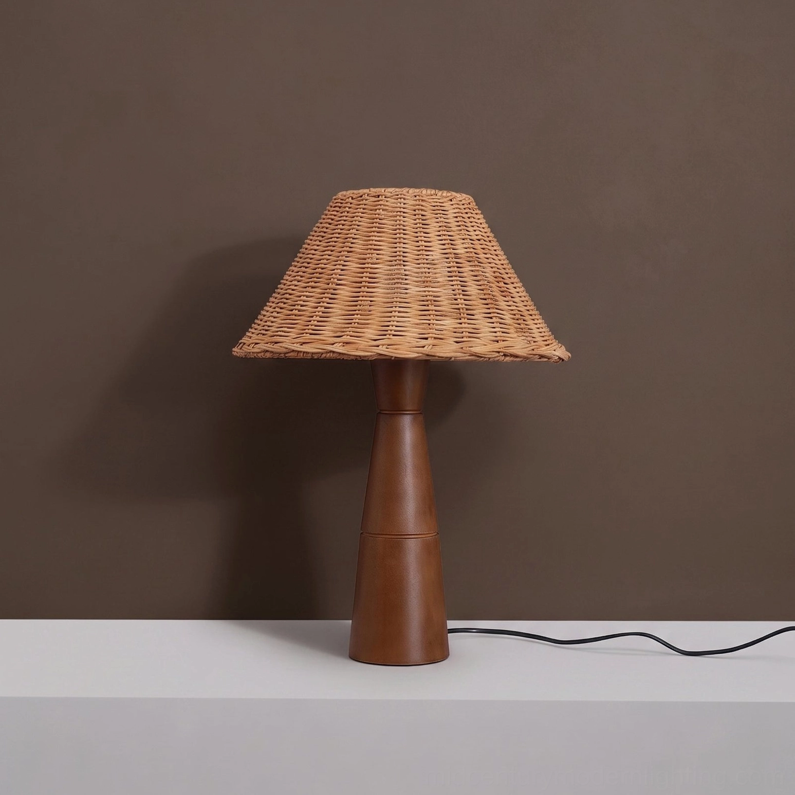 Zaya table lamp lifestyle shot showing warm ambient light in modern minimalist bedroom setting