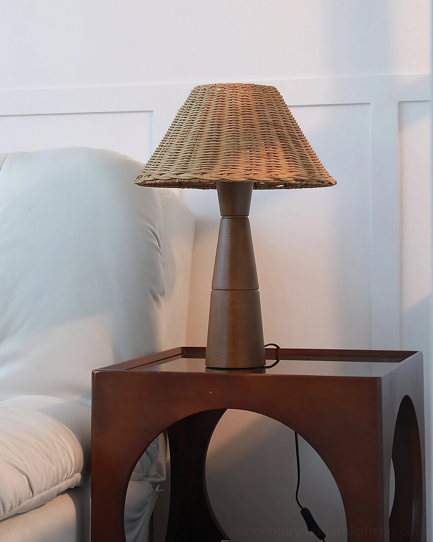Zaya table lamp in gallery corner with art books and curated home accessories, collected narrative design