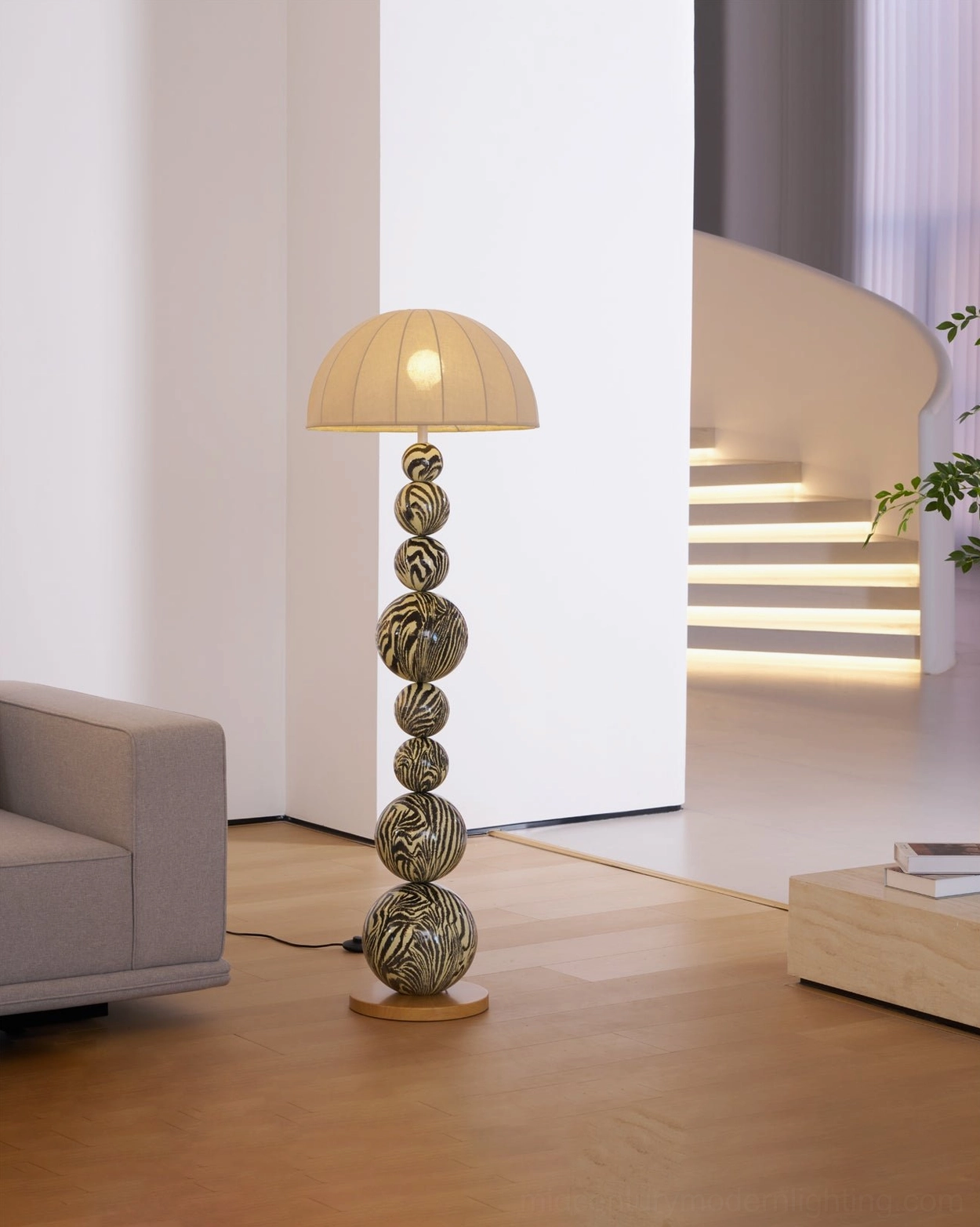 Compact zebra striped floor lamp in modern minimalist living room with staircase, side view detail