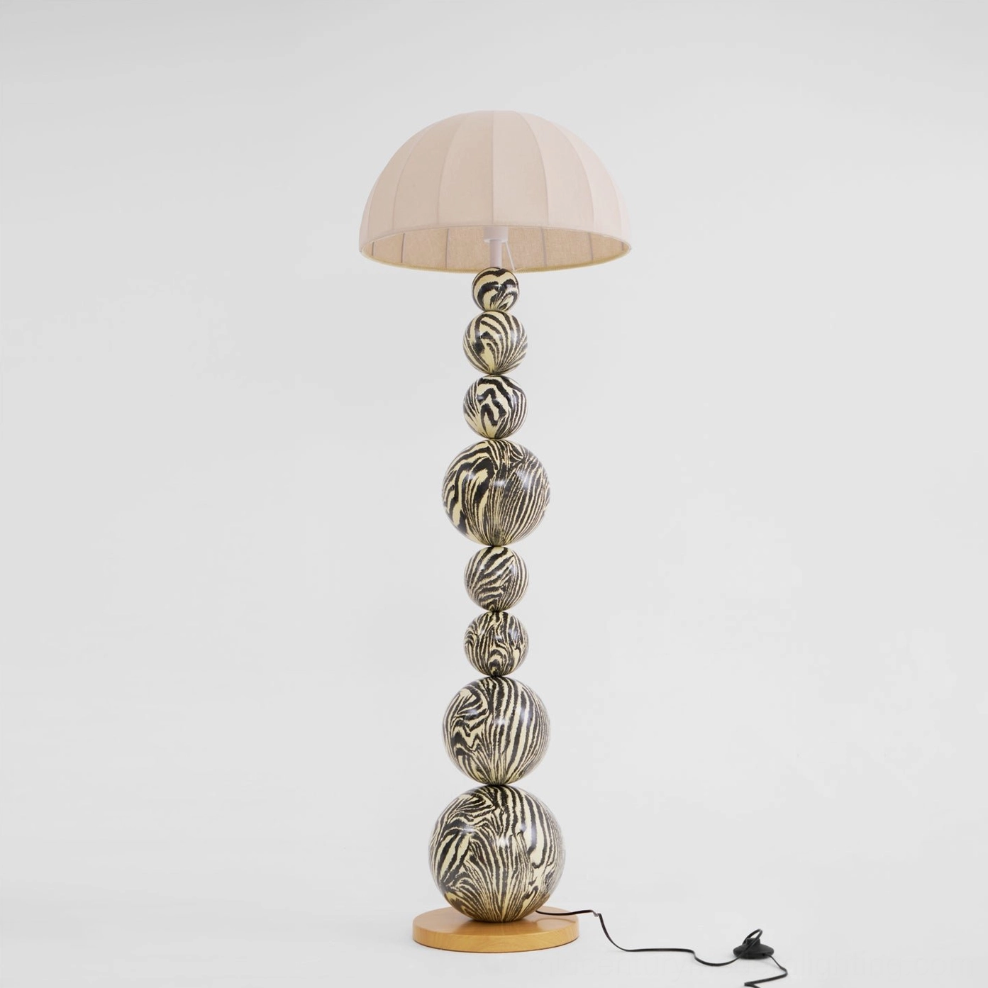 Contemporary zebra patterned floor lamp illuminated in living room environment, warm lighting effect