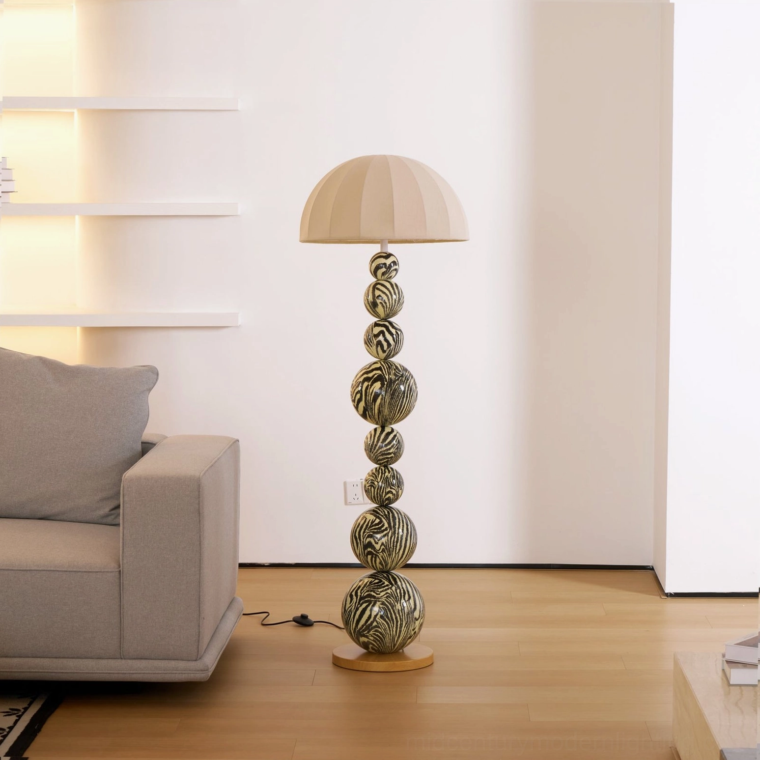 Modern zebra floor lamp in minimalist warm living room setting, three-quarter view showing design integration