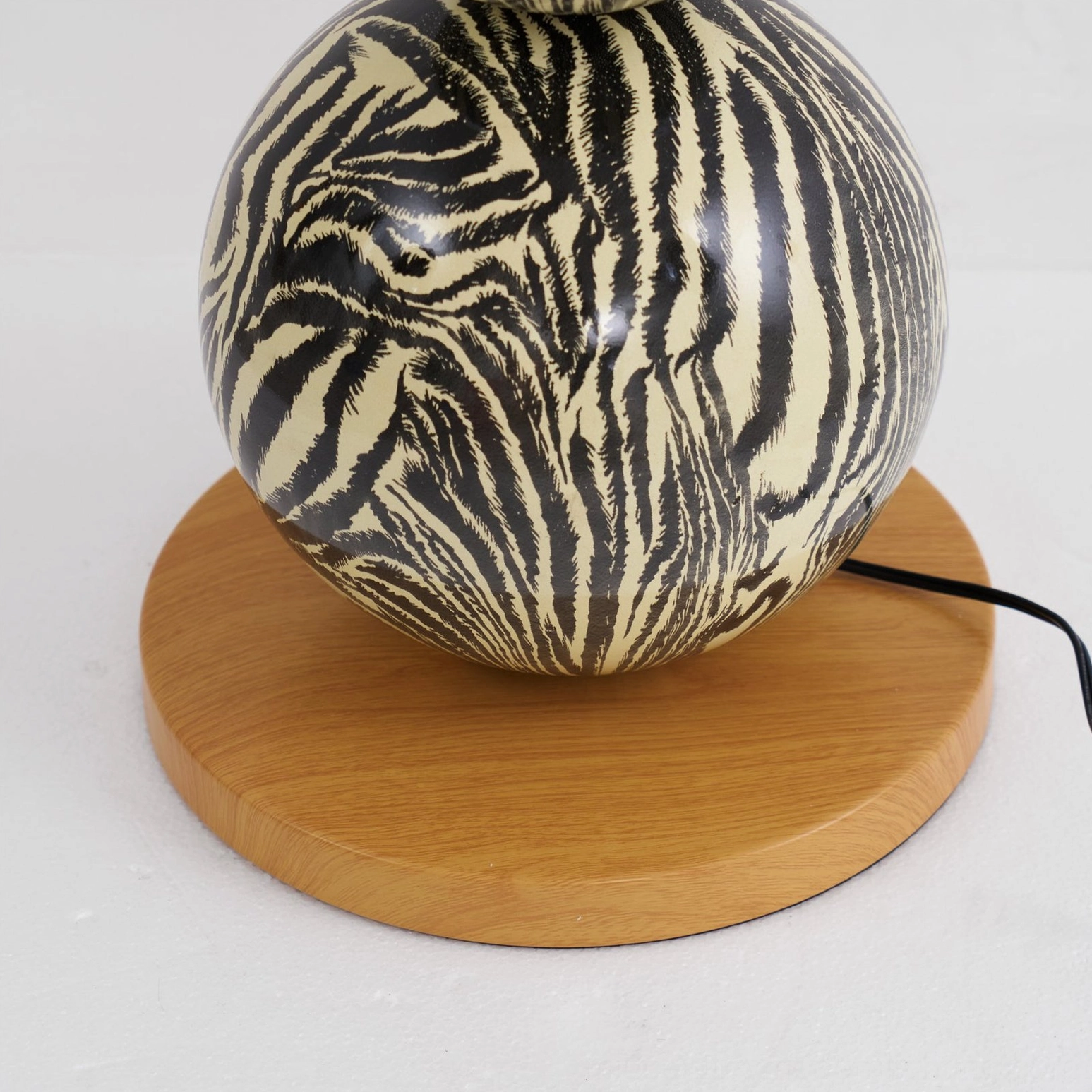 Zebra modern floor lamp providing layered lighting in sophisticated minimalist interior design