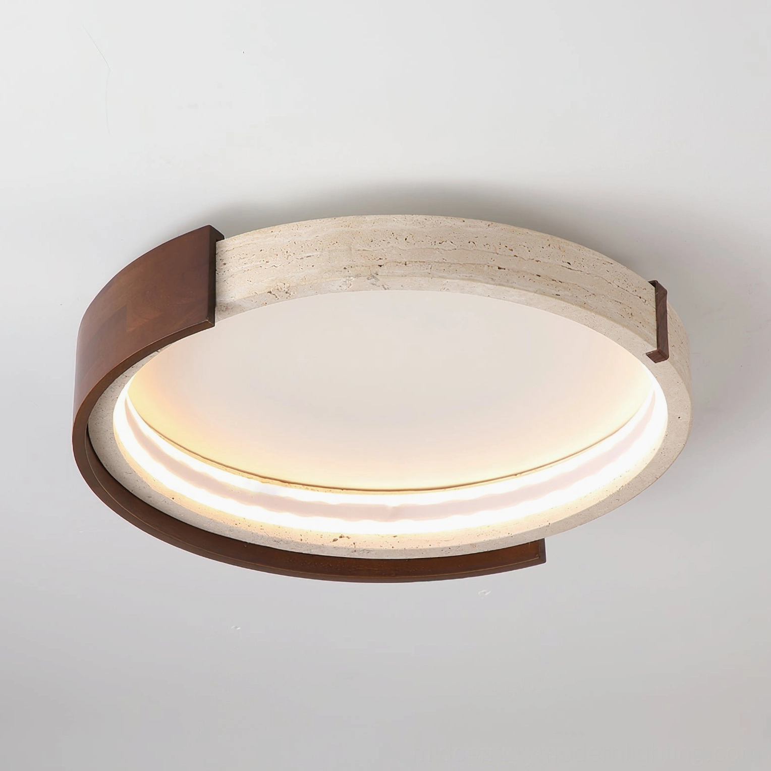 Close-up detail of Zenova ceiling light showing LED glowing two-layer design with travertine stone and walnut wood trim
