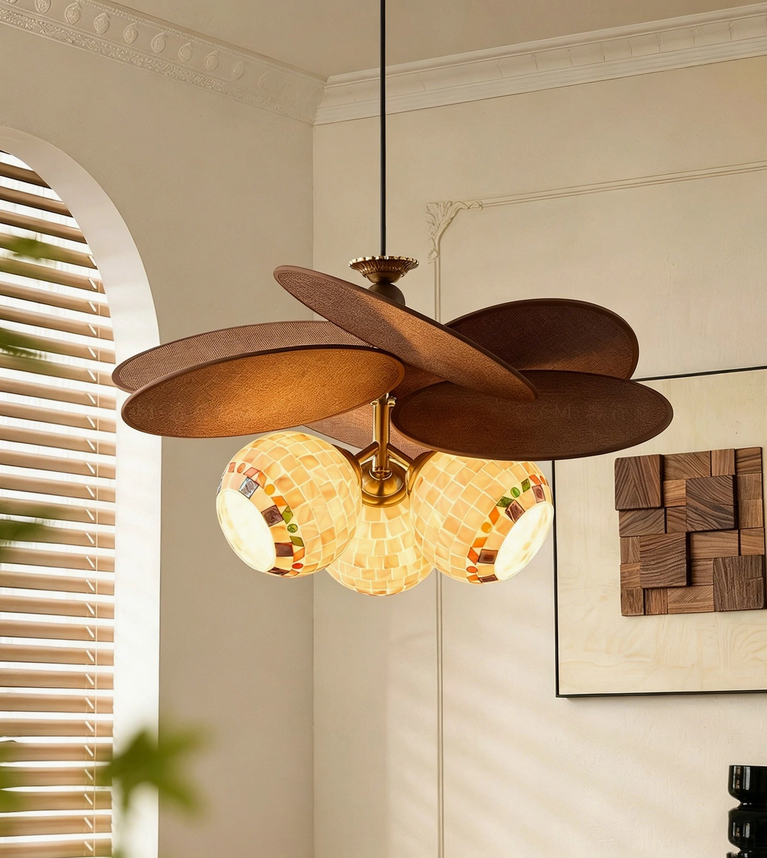 Side view of Zinnia Flora chandelier in mid-century modern living room with arched window