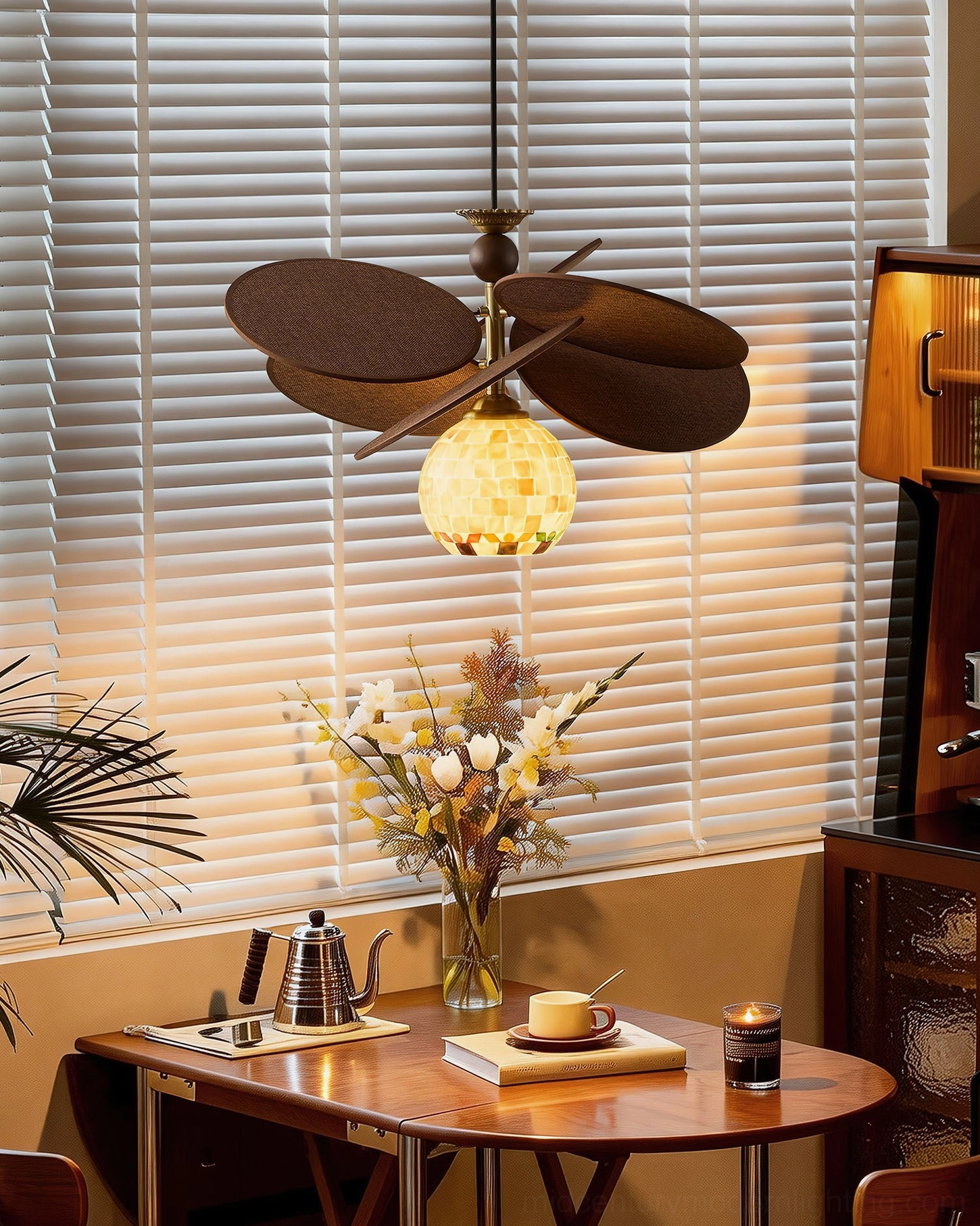 Single mosaic shell globe chandelier detail in retro dining room with louvered blinds