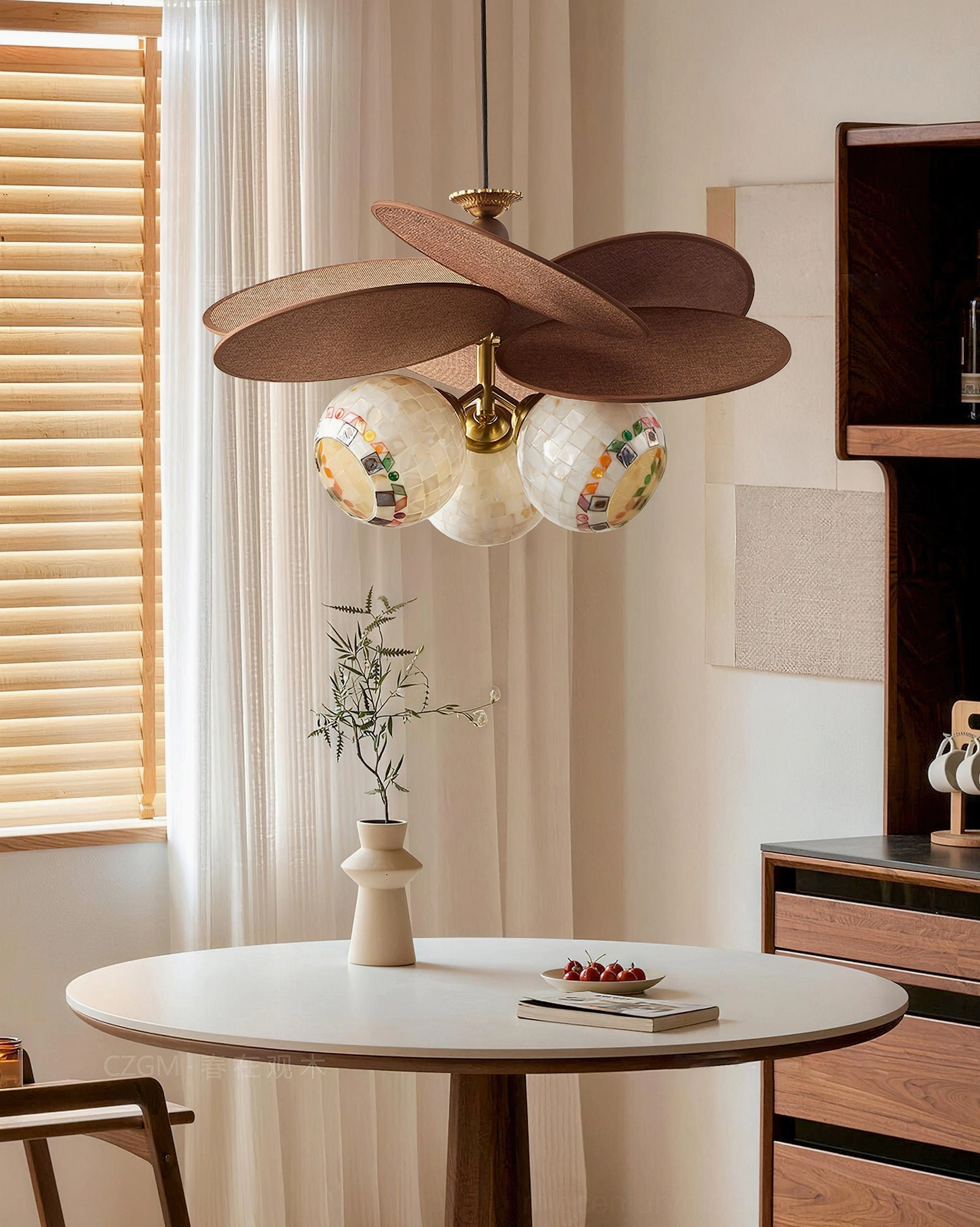 Dual mosaic glass lamps Zinnia Flora chandelier above retro dining table with brass fixtures