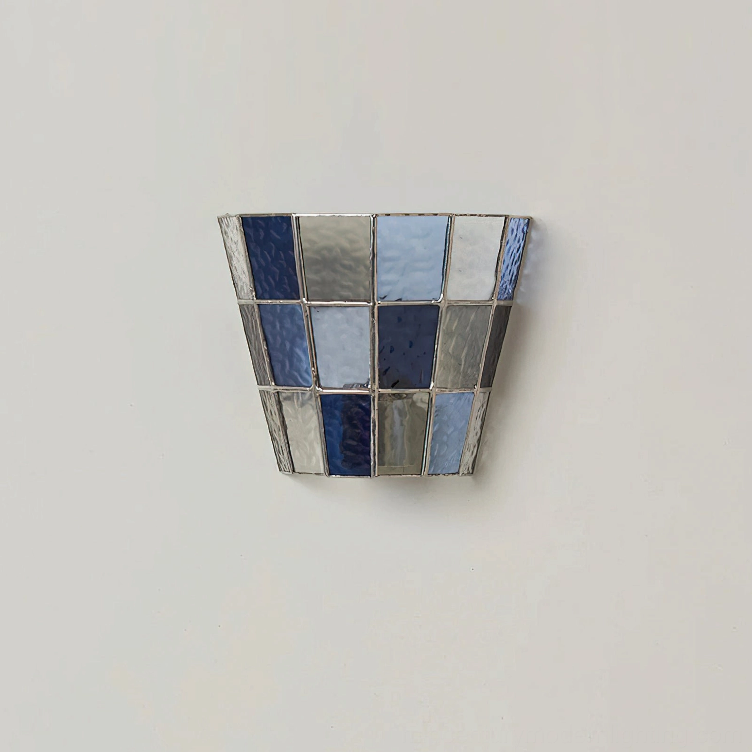 Zola clear glass wall sconce mounted in transitional modern interior as accent lighting